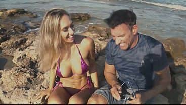 Brianna and Marco Banderas fuck on the beach in full view of many onlookers, letting several of them join in